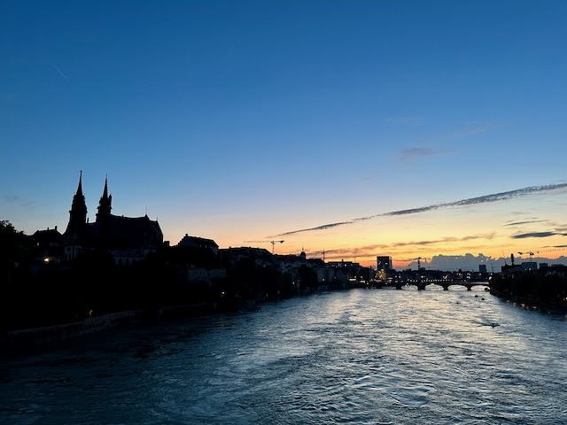 A picture of the river Rhine in Basel in the evening